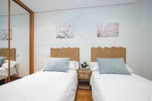 A bed or beds in a room at Villa Josechu en Candás