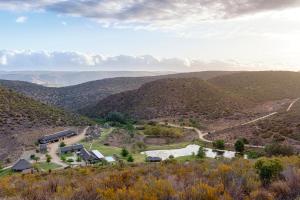 an aerial view of a house in the mountains at Rooiberg Lodge in Van Wyksdorp