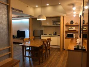 Kuchyň nebo kuchyňský kout v ubytování AJ Residence 安捷國際公寓酒店
