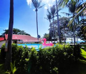 a pool at the resort with a pink flamingo at Lanta Beach Resort in Ko Lanta