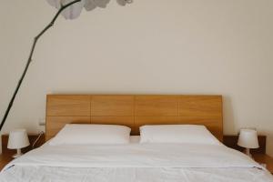 Posteľ alebo postele v izbe v ubytovaní DimSim Home-Σπίτι με όνομα