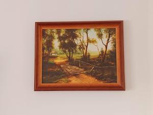 a framed painting of a painting of a field at Papp Vendégház in Balatonederics