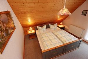 a bedroom with a large bed in a attic at Haus Gerlinde in Zell am Harmersbach