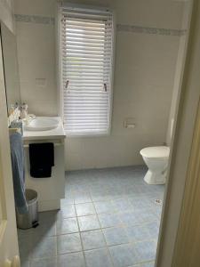 a bathroom with a sink and a toilet at McCracken Homestay in McCracken +22 photos