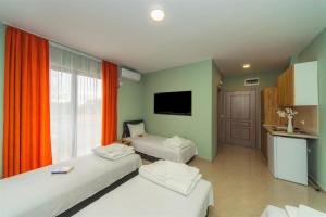 Ένα ή περισσότερα κρεβάτια σε δωμάτιο στο ApartHotel Solaris