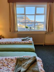 Voodi või voodid majutusasutuse Arsalir Guesthouse Vik B&B toas