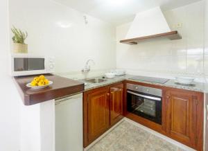 A kitchen or kitchenette at Apartamentos Marcelino - Formentera Break