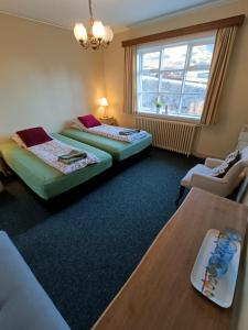 Voodi või voodid majutusasutuse Arsalir Guesthouse Vik B&B toas