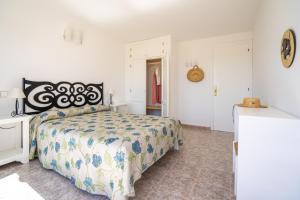 A bed or beds in a room at Apartamentos Marcelino - Formentera Break