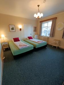 Voodi või voodid majutusasutuse Arsalir Guesthouse Vik B&B toas