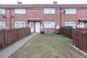 an empty yard in front of a brick house at Oswalds House with Free Parking Ideal for Contractors and Families in Walker Gate
