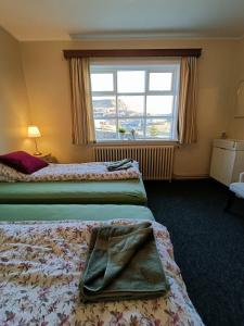 Voodi või voodid majutusasutuse Arsalir Guesthouse Vik B&B toas