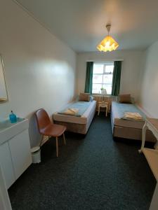 Voodi või voodid majutusasutuse Arsalir Guesthouse Vik B&B toas