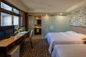 Katil atau katil-katil dalam bilik di Rich & Free Hotel - Kaifeng 富逸旅趣-北車開封館
