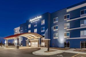 a rendering of the front of a hotel at night at AmericInn by Wyndham International Falls in International Falls