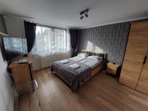 Ένα ή περισσότερα κρεβάτια σε δωμάτιο στο Loft Wisla Houses