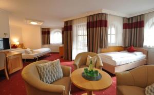 Postel nebo postele na pokoji v ubytování Heart Hotel Himmelberg