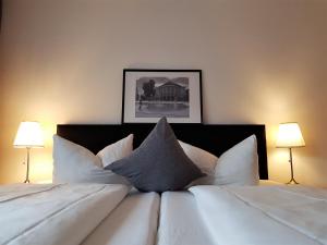 Postel nebo postele na pokoji v ubytování Apart Hotel Freiburg
