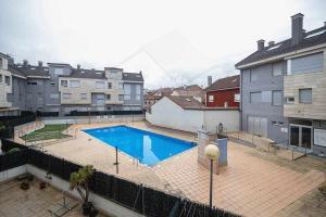 a large swimming pool on top of a building at Casina de Dante By Silastur in San Juan de la Arena