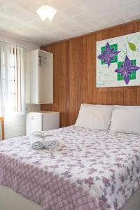 a bedroom with a large bed with two rings on it at Pousada Estrela da Manhã in São Pedro da Serra