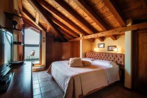 a bedroom with a bed in a room with a window at Charming & Luxury Villa Como Lake in Como