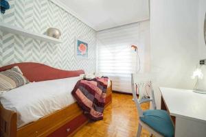 Postel nebo postele na pokoji v ubytování Ezcurdia Apartamento