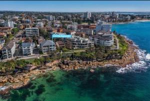 an aerial view of a city and the ocean at Esplanade Bliss in Cronulla