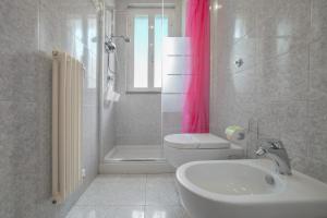 a bathroom with a sink and a toilet and a shower at B&B Dei Musicisti in Polignano a Mare