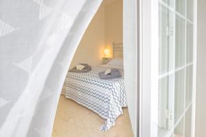 Ένα ή περισσότερα κρεβάτια σε δωμάτιο στο B&B Dei Musicisti