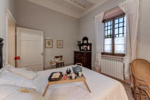 Ένα ή περισσότερα κρεβάτια σε δωμάτιο στο Villa Bonsi +122 φωτογραφίες