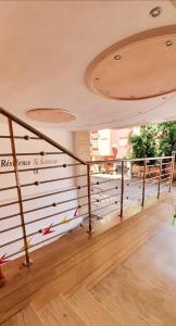 a staircase in a building with a railing at El kawtar 18 appart-hôtel in Kenitra