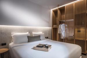 Posteľ alebo postele v izbe v ubytovaní Enorme Ammos Beach Resort