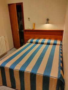 Postel nebo postele na pokoji v ubytování Pensión Coral