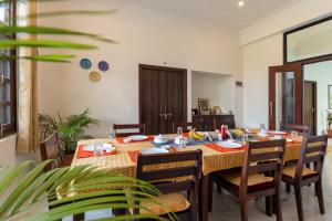 a dining room with a table and chairs at Jass Bagh Home stay Udaipur I swimming pool I wedding I 87oo2o5865 in Udaipur