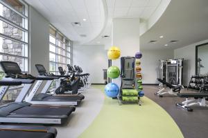 a gym with treadmills and cardio machines at Archer Hotel Seattle/Redmond in Redmond