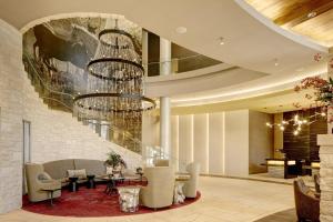 a lobby of a hotel with a chandelier at Archer Hotel Austin in Austin