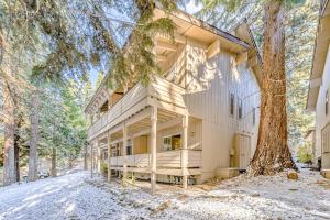 a large house with a tree in front of it at Take Me to Tahoe in Incline Village