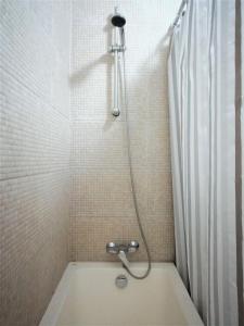 a bathroom with a shower with a bath tub at CASA - Mary Ann's House in Trujillo