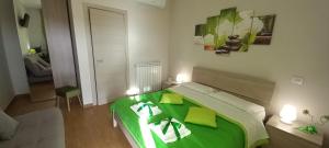 Postel nebo postele na pokoji v ubytování B&B LE BACETTE