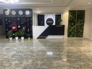 a store with a marble floor and a counter with plants at CITIZEN HOTEL in Nukus