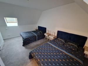 Ένα ή περισσότερα κρεβάτια σε δωμάτιο στο Haut standing Proche zone industrielle