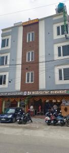 a building with motorcycles parked in front of it at Octave Vels Grand Hotel in Bangalore