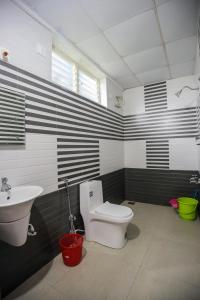 Koupelna v ubytování zanbaq residency