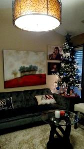 a living room with a christmas tree and a couch at la casa de Carmen in Charlotte