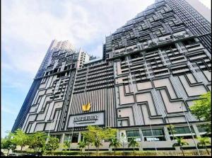 a large building with a sign on the side of it at SeaView#Warmth#Netflix#PrivateBathtub#SeaSideLuxuryCondo#ImperioResidence in Melaka