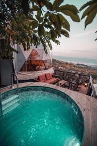 a swimming pool with a view of the ocean at Sapanca Dome Glamping in Sapanca