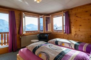 Postel nebo postele na pokoji v ubytování Chalet Weisshorn 2