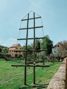 a large wooden christmas tree sitting in a field at Bayerischer Hof Spalt in Spalt