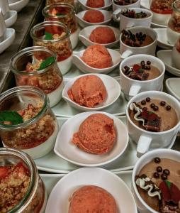 a table filled with plates of desserts in bowls at Bayerischer Hof Spalt in Spalt