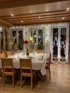 a dining room with a table and chairs and christmas decorations at Bayerischer Hof Spalt in Spalt